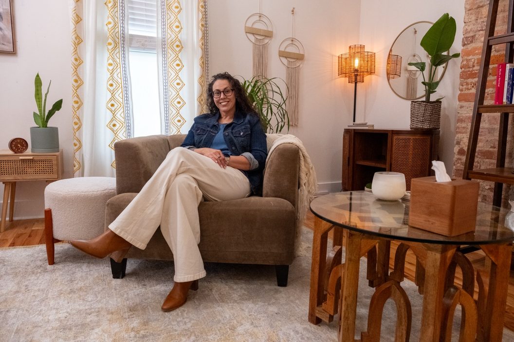 Tiffany Acuff seated in the armchair of her Nashville therapy office